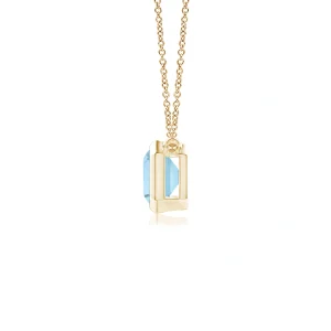 Emerald-cut aquamarine pendant in east-west bezel setting