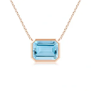 Aquamarine pendant in rose gold bezel setting