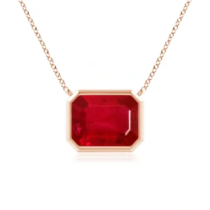 Emerald-cut ruby pendant in rose gold bezel setting