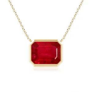 Emerald-cut ruby pendant in yellow gold bezel setting