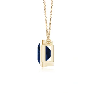 Side view of sapphire pendant in yellow gold bezel setting