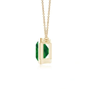 Side view of emerald-cut emerald pendant in yellow gold bezel setting